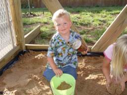 Tommy in sandbox.JPG
